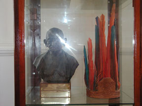 A bust of Gandhi from India and a feathered
